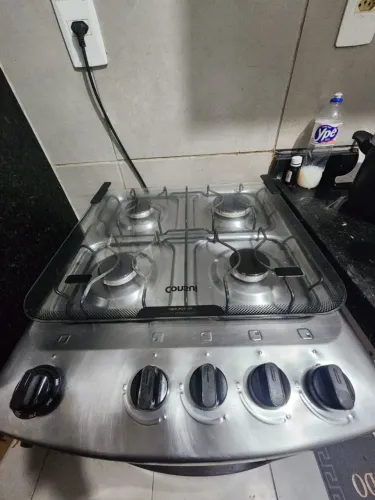Vendo fogão Consul 4 bocas, com acabamento inox e mesa com tampa de vidro.
