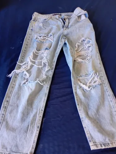 calça rasgada Jeans 
