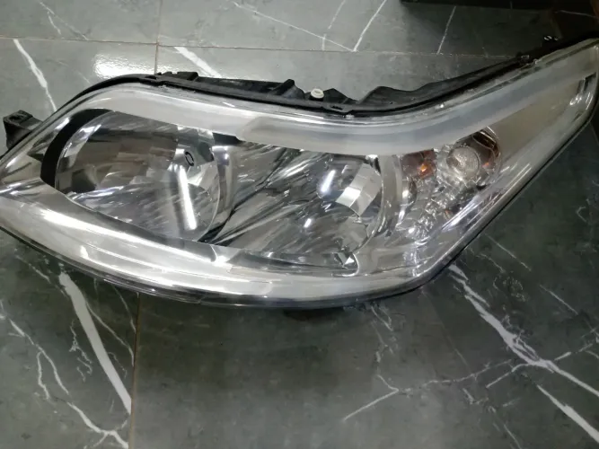 Farol C4 Pallas esquerdo original 