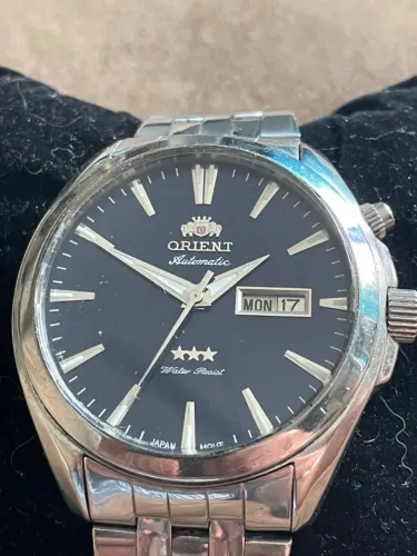 RELÓGIO ORIENT AUTOMATIC 03 ESTRELAS WATER RESIST 50M DAY DATE BLUE DIAL 44MM