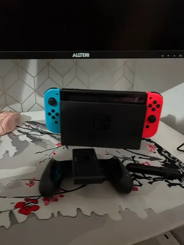 Nintendo Switch console + Super Smash Bros