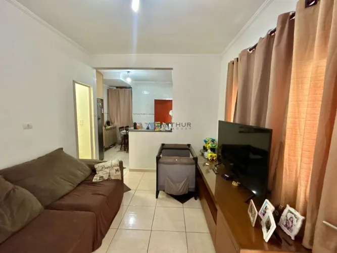 Sobrado de condomínio à venda em Praia Grande no Bairro Nova Mirim