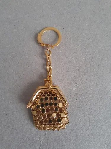 Chaveiro Porta-moedas em metal dourado