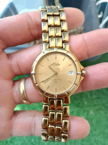 Relógio mido quartzo, pulseira pequena aproximado 16cm.