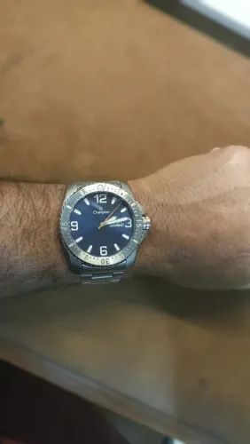 Relógio Champion Masculino de Aço Prateado Com Fundo Azul e Calendário
