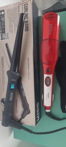 Vendo1 modelador de cachos e chapinha bivolt, modelador acompanha a luva.