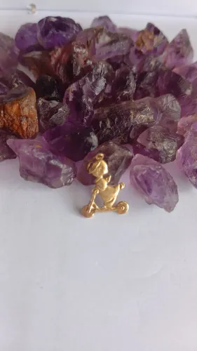 Pingente ouro 18k 750 Arcanjo no patinete