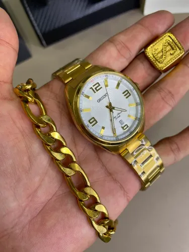 Relogio Quartzo Orient Dourado com brindes