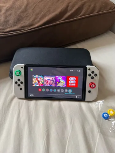 Nintendo Switch OLED impecável ( aceita trocas)