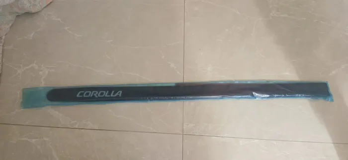 Friso porta Corolla 