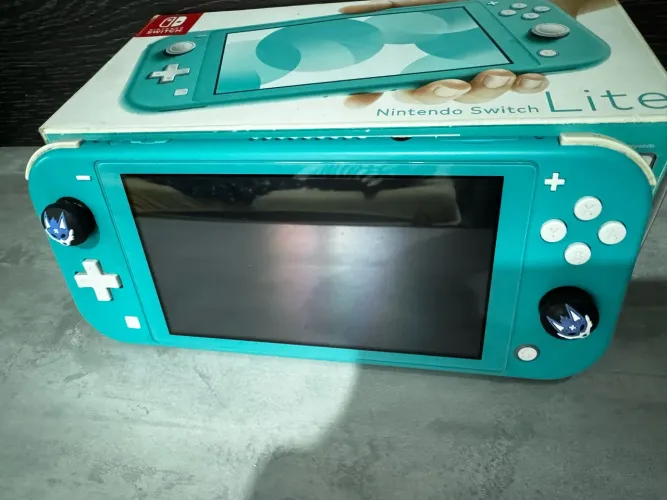 Switch Lite Em ótimo estado bloqueado com caixa + película