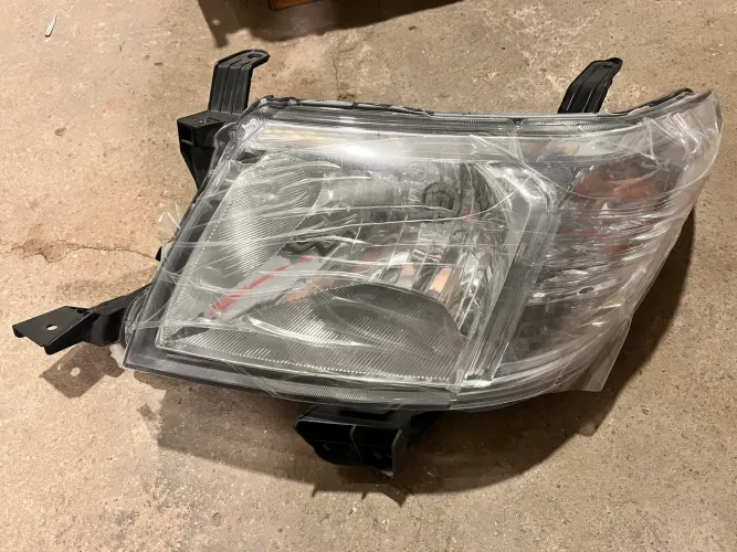 Farol HILUX 2013 ORIGINAL esquerdo
