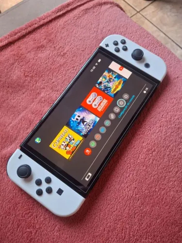 Dock + Nitendo Switch Oled branco + Super Mario Wonder e outros jogos