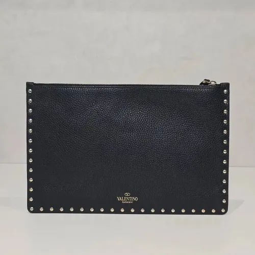 <br>ROCKSTUD LEATHER POUCHValentino Garavawned<br>Rockstud leather clutch bag