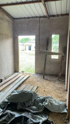 Terreno com casa quase pronta