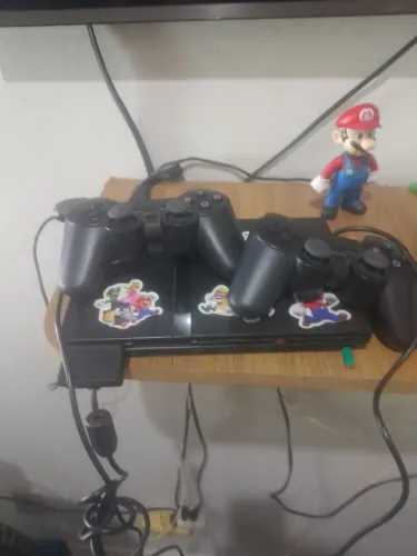 Playstation 2 funcionando acompanha 10 jogos e 2 controles tudo funcionando
