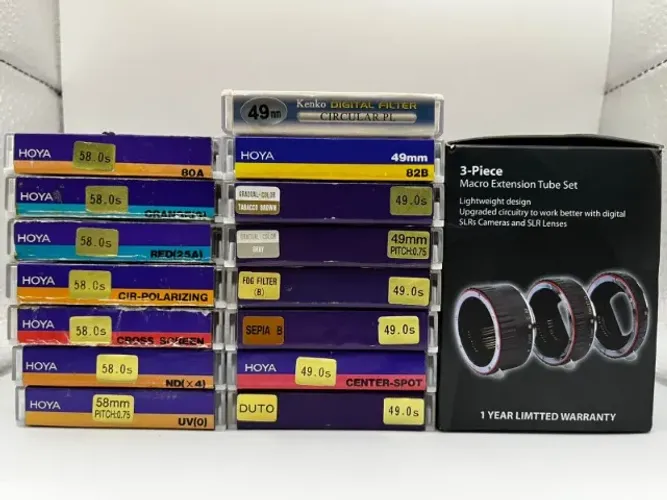 Acessórios fotográficos - filtros e anéis variados, tripés, controles, tampas etc