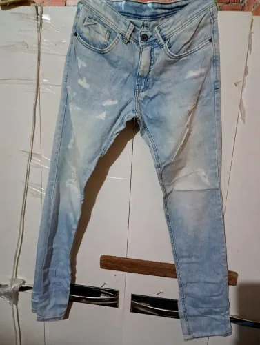 Calça Jeans Rasgada