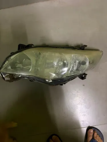 Farol dianteiro lado esquerdo Original Toyota