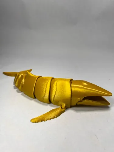 Escultura de Baleia Articulada Dourada