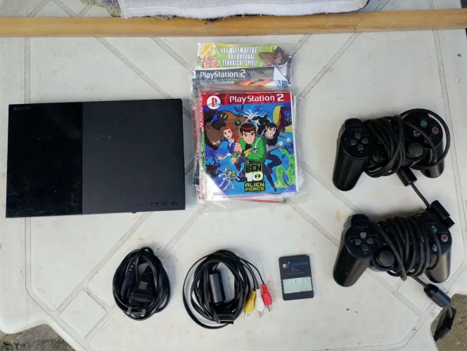Playstation 2 desbloqueado troco em celular.