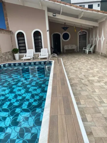 Casa com 3 dormitórios à venda, 159 m² por R$ 850.000,00 - Caiçara - Praia Grande/SP