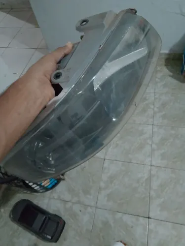 Farol original do gol g4 mascara cinza lado direito