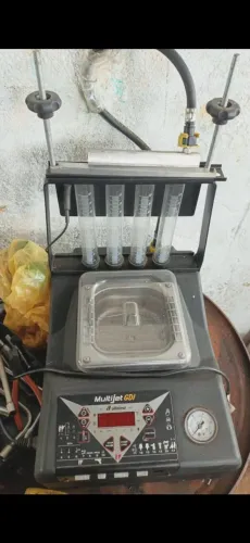 Maquina de teste e limpador de bico
