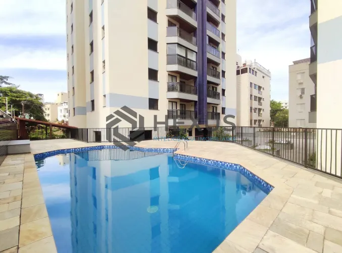 Apartamento com varanda e lazer na Praia do Tombo, Guaruja