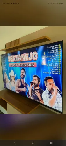 Smart TV 65 4K borda infinita comando de voz seminova na caixa...