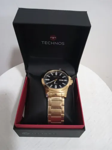Vendo relógio technos pulseira de aço dourado aprova dágua novo. 