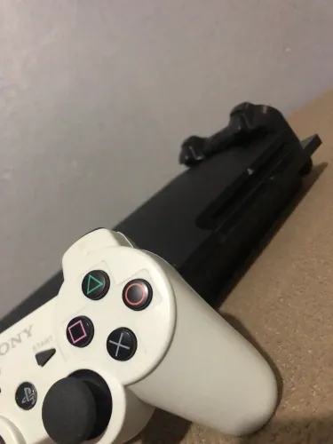 Ps3 slim com 2 controles + de 10 jogos - entrego