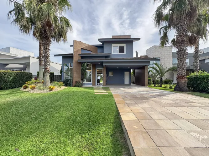 Casa beira lago mais barata á venda no condomínio Enseada Lagos Xangri-Lá - 190m2 - 03 suí