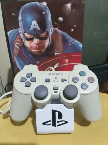 Controle de PlayStation One original com defeito