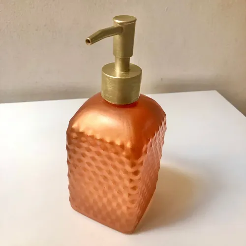 Porta sabonete líquido em vidro texturizado cobre e dourado