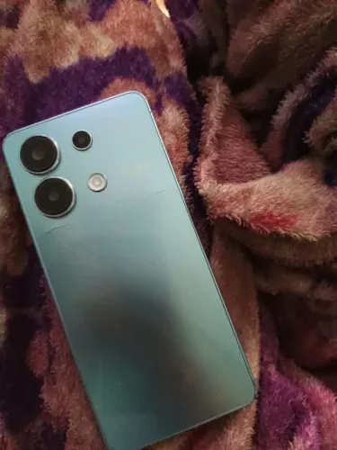 Celular redimi note 13, trincado um pouco atrás, todo original tá com película