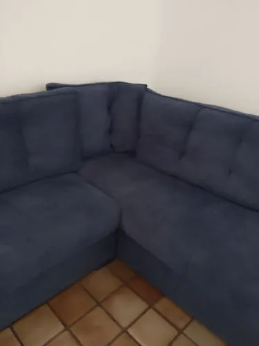 Sofá azul semi-novo