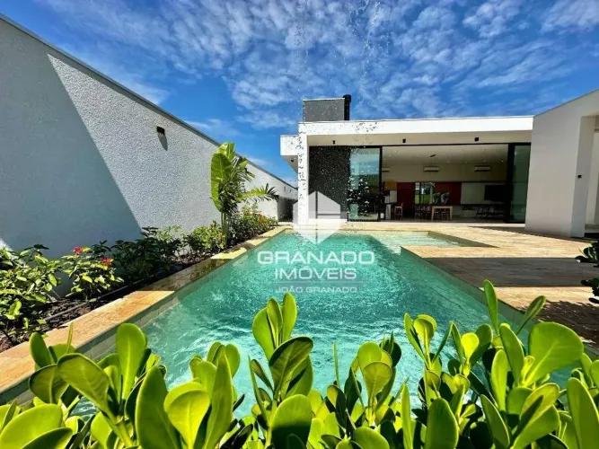 Casa com 5 dormitórios à venda, 380 m² por R$ 4.000.000,00 - Condomínio Porto Rico Resort