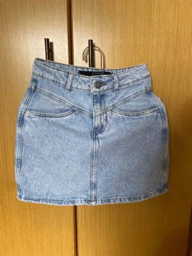 Na etiqueta Saia Jeans Feminina YouCom
