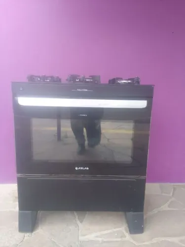 Vendo esse fogão inteirinho de 5 bocas funciona tudo só buscar em Canoas não entrego 450