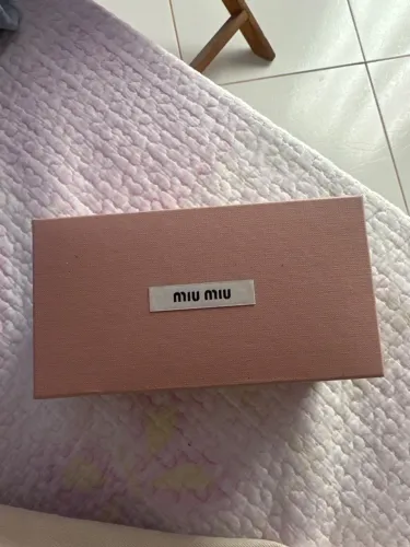 Óculos Miu Miu SMU A06