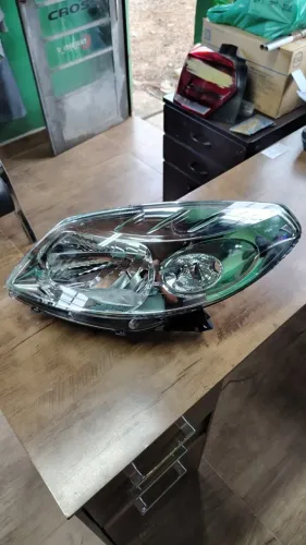 Farol esquerdo Sandero 2008 2009 2010 2011 novo original cromado
