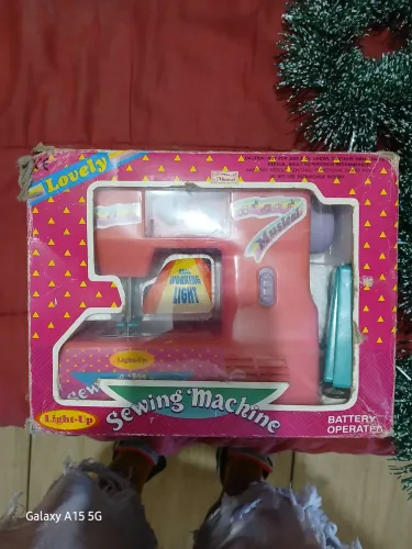 Máquina de costurar de brinquedo