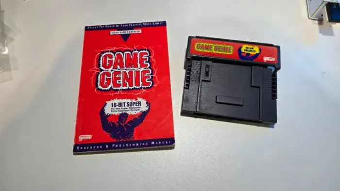 Game Genie original para Super Nintendo SNES com manual/livro de códigos