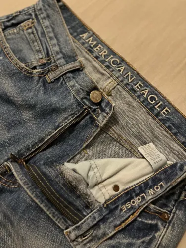 jeans destroyed e com tinta splash american eagle outfitters