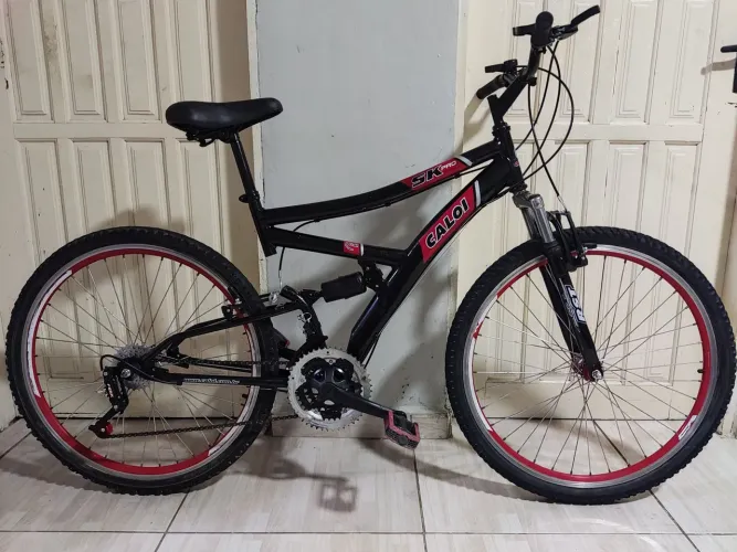 Bicicleta dupla suspensão Caloi aro 26