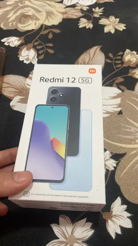 Vendo ou troco celular redmi 12 128 gigas com todos os acessórios