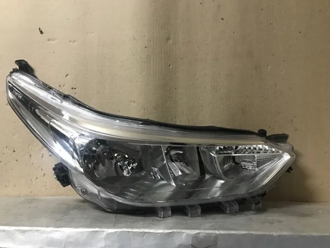 Farol Toyota Yaris cromado manual direito passageiro