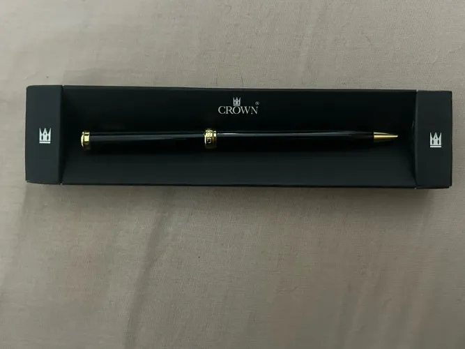 caneta crown preta e dourada esferográfica azul