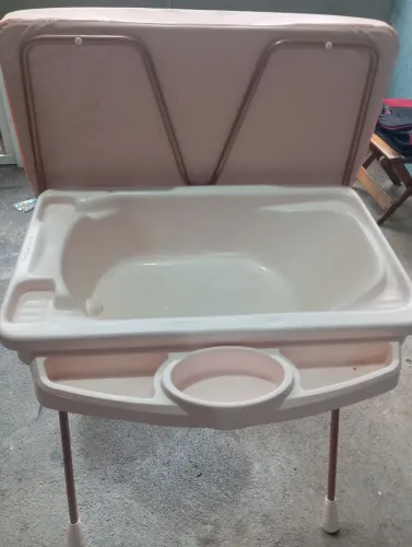 Oportunidade um carrinho de bebe um bebe conforto e uma banheira